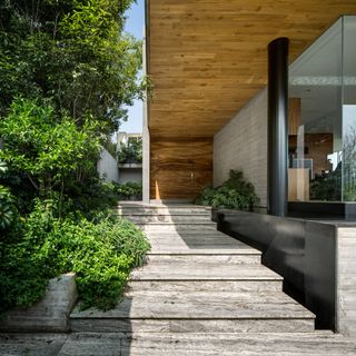 Stone steps through street to the house’s main entrance