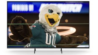 The Philadelphia Eagles mascot dances on the stage during the NFL Super Bowl LVII Opening Night