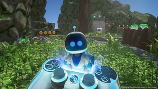 Astro Bot sits on a PlayStation 4 controller