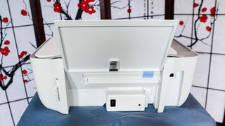 HP DeskJet 2755e on table in livingroom