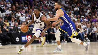 Two men playing basketball