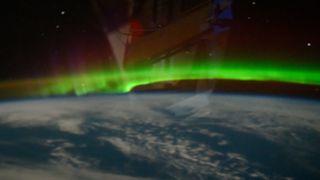 a ribbon-like aurora over earth