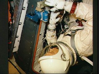 Michael Collins, pilot of the Gemini 10 spaceflight, undergoes zero-gravity egress training aboard a KC-135 Air Force plane.