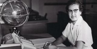 Young Katherine Johnson sits at her desk with a big globe