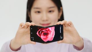 Woman showing Samsung display Flex In&amp;Out