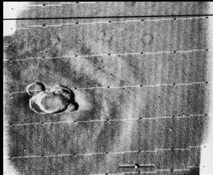 In a picture taken early in the Mariner 9 mission, Olympus Mons stands above a Martian dust storm.