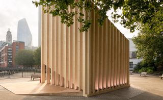 Wooden structure partly hidden by trees