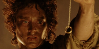 Frodo Baggins (Elijah Wood) holds the One Ring on a long chain in 'Lord of the Rings: Return of the King'