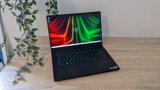 Razer Blade 14 gaming laptop on a wooden desk