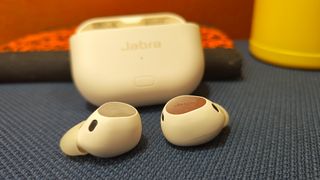 Jabra Elite 10 gen 2 on a blue cushion