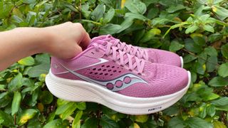 Person holding the Saucony Ride 17 running shoe