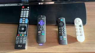 a hotel, roku, Fire TV and Chromecast remote in a row