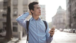 Man Using Smartphone on the Street