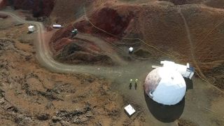 HI-SEAS V crewmembers Brian Ramos and Laura Lark walk around the mock Mars habitat.