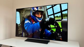 LG OLED48C3 with a racing driver on screen