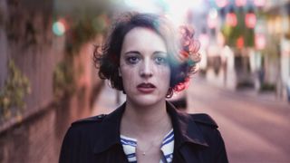 Fleabag (Phoebe Waller-Bridge) with tears streaming down her cheeks as she looks into the camera.