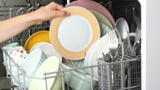 A dishwasher which hasn't been loaded correctly with bowls the wrong way up