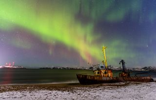 The northern lights are seen over Teriberka, Russia, a village with the population of about 1,000 people, located some 120 km away from the city of Murmansk on the Russian Arctic coast on Oct. 30, 2021.