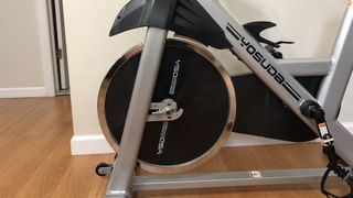 The front wheel of the Yosuda Indoor Cycling Stationary Bike