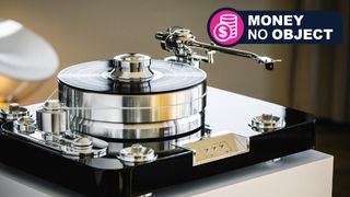 Pro-Ject Signature 12.2 Flagship turntable on a beige plint, with TR's 'Money no object' franchise badge