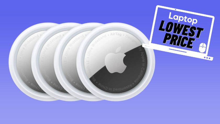 Four Apple AirTags against blue gradient background