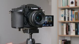 The Panasonic GH6, one of the best 4K cameras, mounted on a tripod