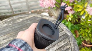 Sony ULT Field 1 wireless speaker held in hand showing end of speaker