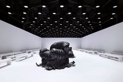 Acne Studios A/W 2024 show set with Villu Jaanisoo’s rubber tire sofas