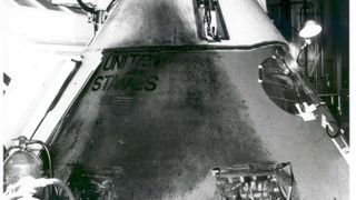 A photograph of a large charred patch on the Apollo 1 module.