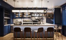 Room with countertop and grey chairs