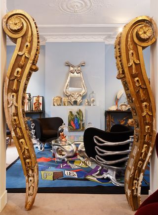 A pair of 19th century baroque columns frame Vincent Darré's 'Squelette' armchairs and 'Bassin' low table