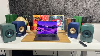 KEF LSX II vs KEF LSX II LT side by side shot with a laptop