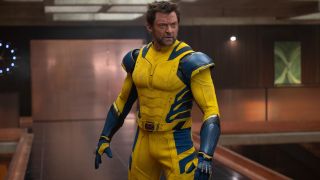 Hugh Jackman stands angrily in the TVA in Deadpool and Wolverine.