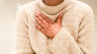 Can basement mold make you sick: image shows woman with bretahing difficulties