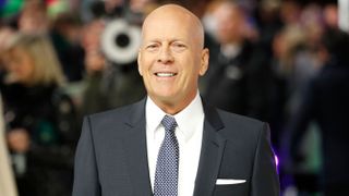 Bruce Willis poses on arrival for the European premiere of “Glass” in central London on Jan. 9, 2019. The actor just announced he is stepping away from his acting career due to difficulties he’s having related to a diagnosis of the language disorder called aphasia.