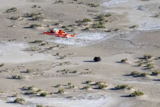 The sample return capsule from NASA’s OSIRIS-REx mission is seen shortly after touching down in the desert, Sunday, Sept. 24, 2023, at the Department of Defense's Utah Test and Training Range. 