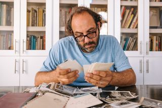 Chef Fadi Kattan looking at photographs