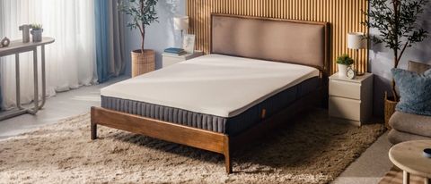 The Emma Luxe mattress on a bed frame in a neatly decorated modern room