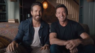Hugh Jackman and Ryan Reynolds sitting side by side in the Deadpool 3 announcement video