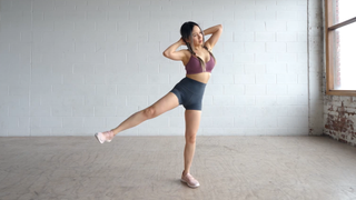 a photo of Chloe Ting doing a standing abs workout 