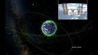 The Orbitrack app uses green dots to represent each satellite. The app's Orbit Mode readily illustrates the difference between the low Earth orbit (LEO) satellite orbits, such as the International Space Station (inset), and the much more remote geosynchronous satellites (the curved chain of satellite symbols) that are employed for television broadcasts and other applications. When you select a single satellite, its name and orbit are drawn.