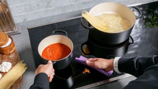 Two induction pans on a GE Appliance induction cooktop