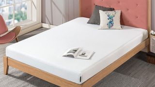 The Zinus Green Tea mattress on a bed