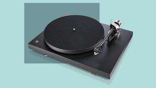 Pro-Ject Debut Pro turntable on a blue background