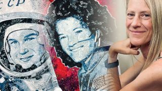 a woman with blonde hair smiles in front of two quilts that feature portraits of women in spacesuits