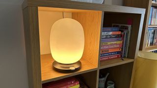 The SkyView 2 connected lamp on a wooden bookshelf