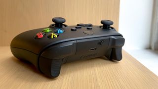 A photograph of the Xbox Series X wireless controller from the side