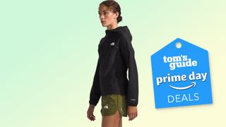 The North Face Higher run jacket on model with green background and Prime Day deal badge bottom right