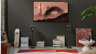 KEF LSX II LT on speaker stands in a room