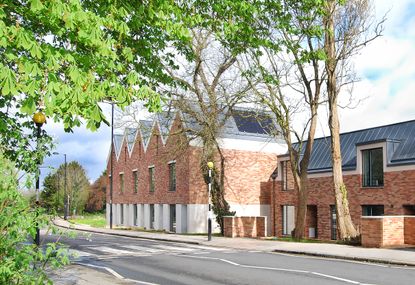 hermitage mews interiors and exterior showing dressed home with white walls and brick exterior